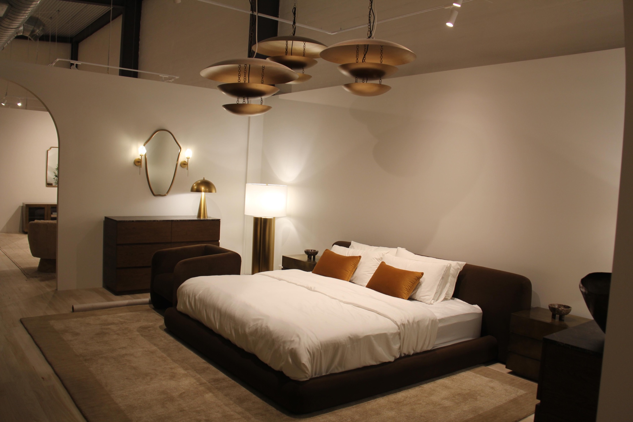 Brass pendants and a recessed bed setting