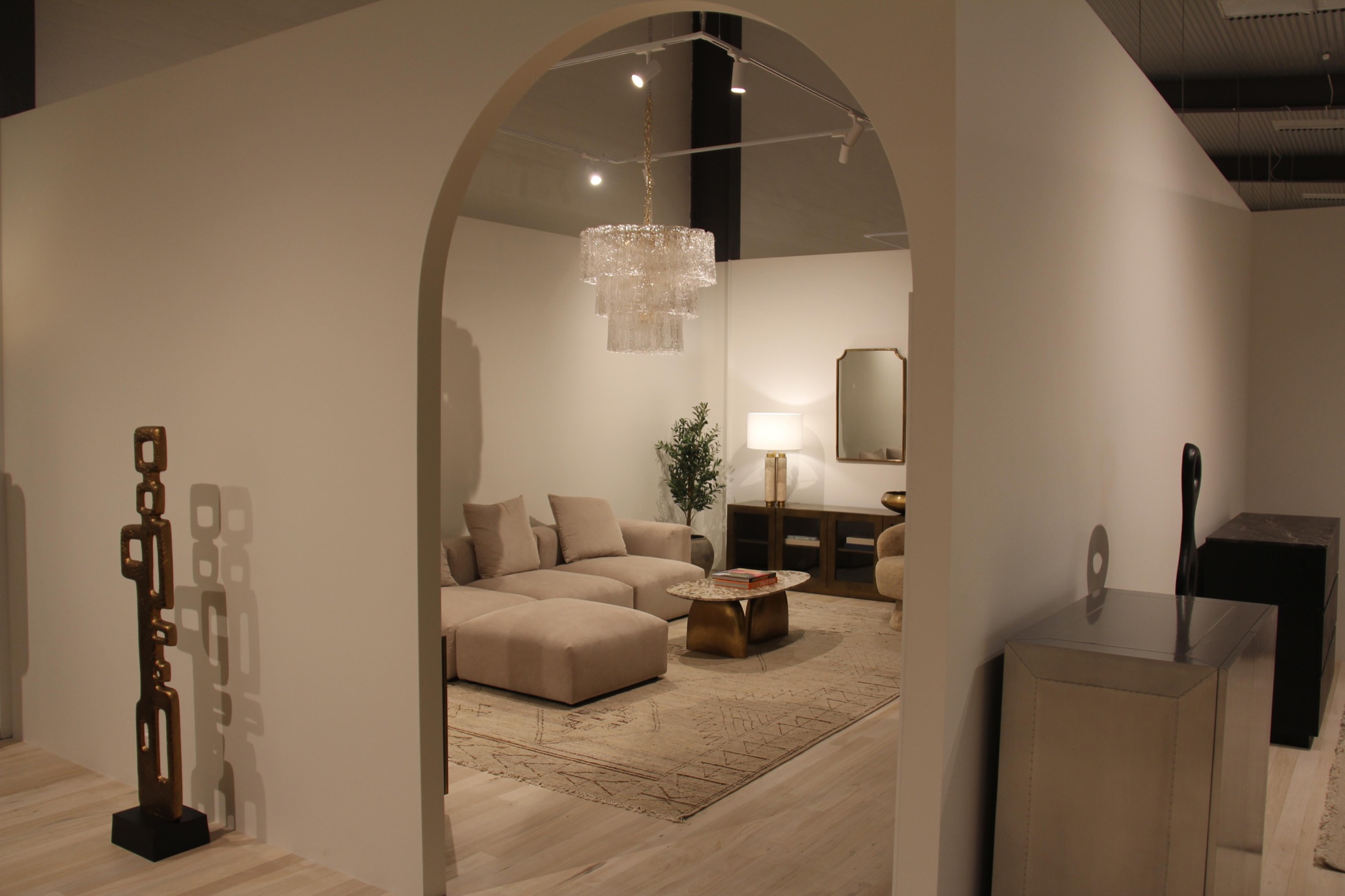 A lounge setting seen through an arched opening