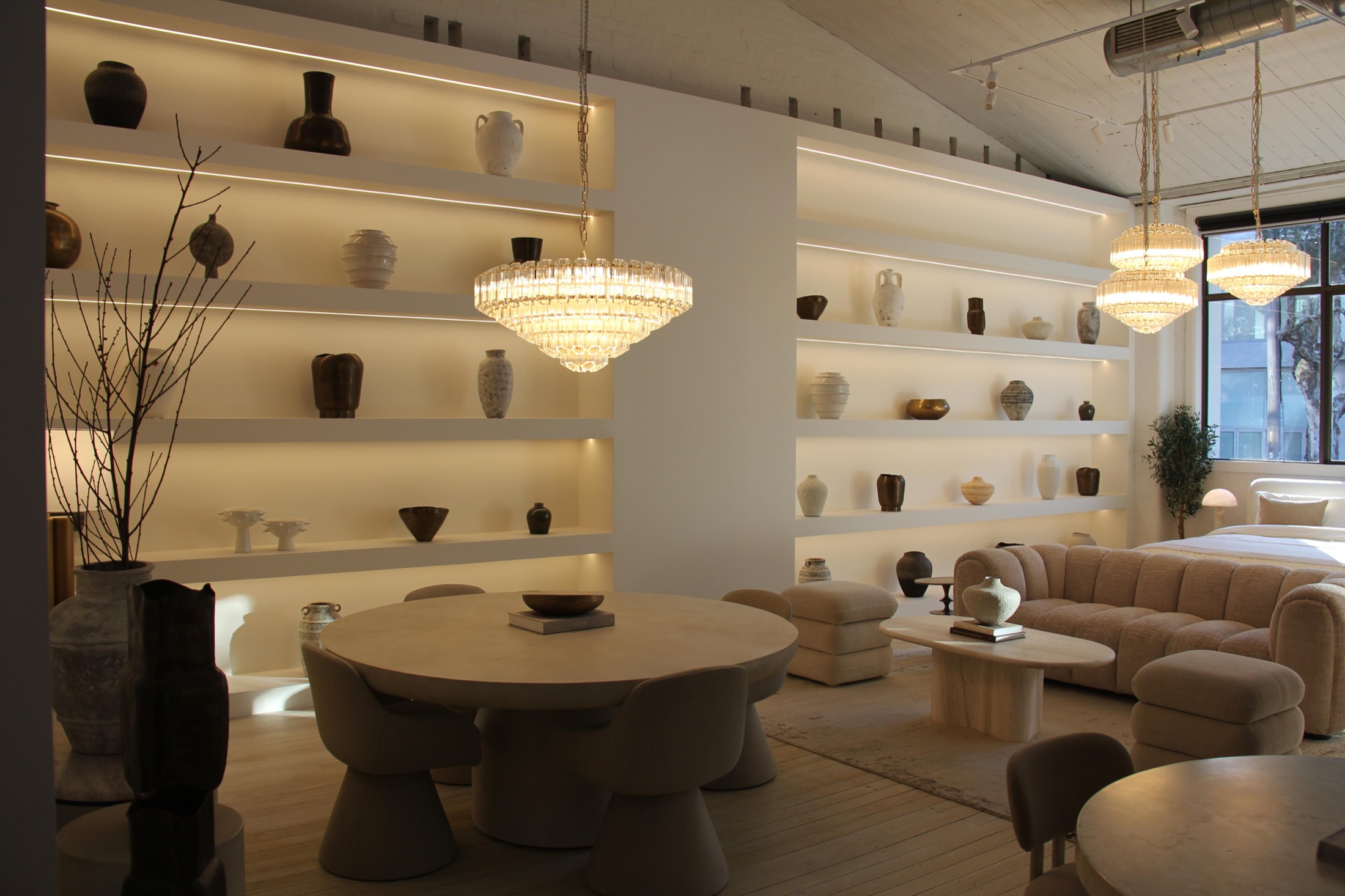Dining and the lit shelving wall